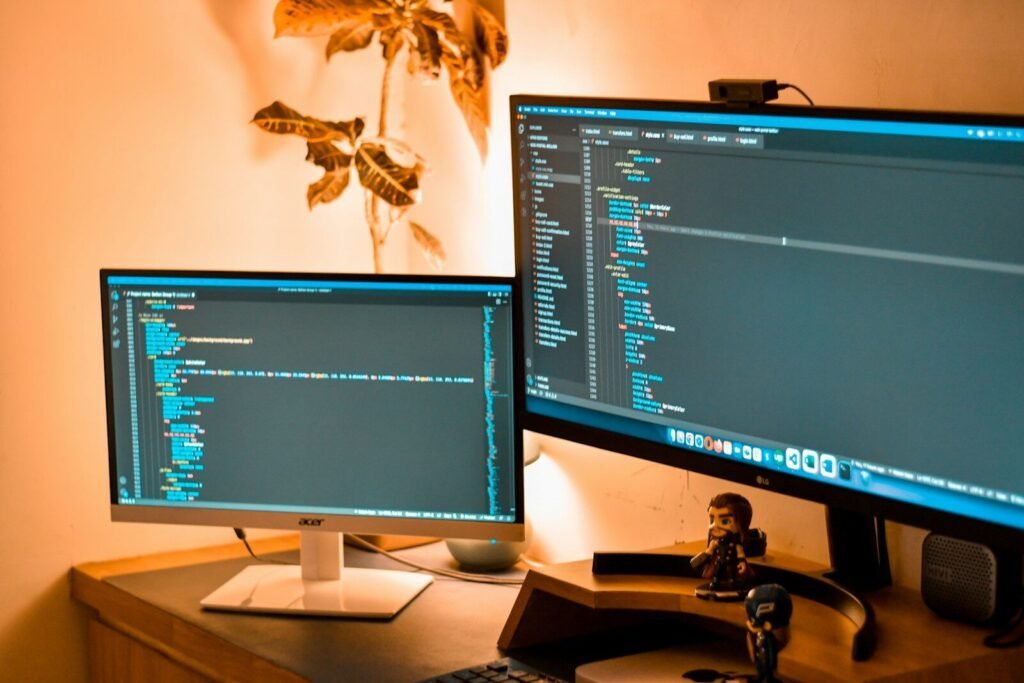 a couple of computer screens